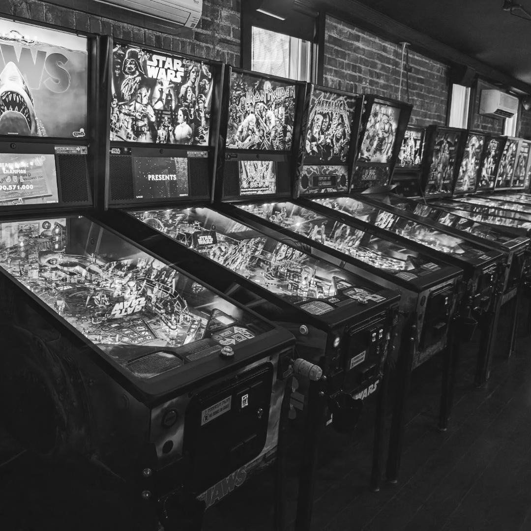 May be an image of pinball machine and text