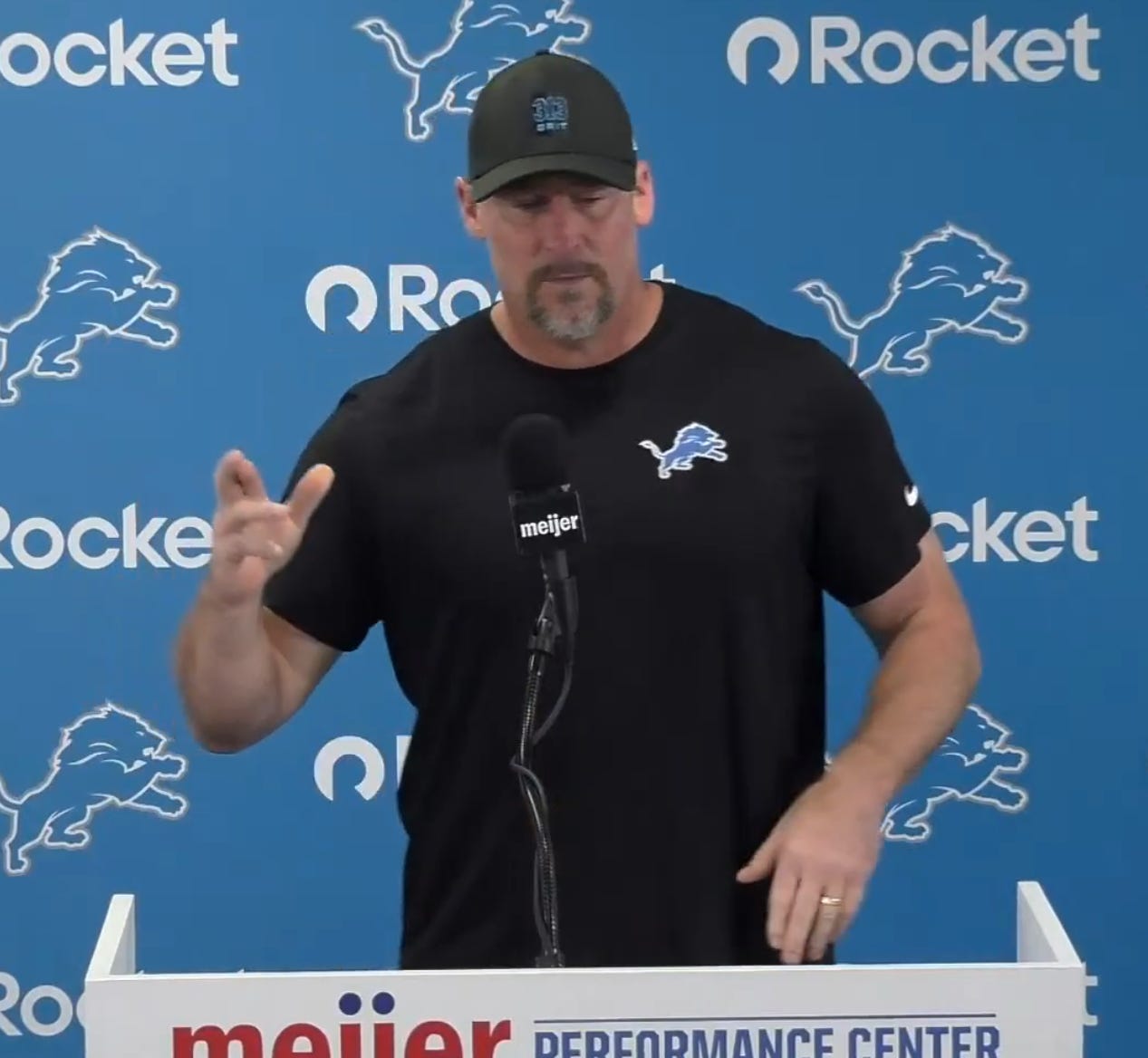 Dan Campbell Detroit Lions 2026 training camp press conference crossing his fingers Dan Campbell Detroit Lions 2026 training camp press conference crossing his fingers