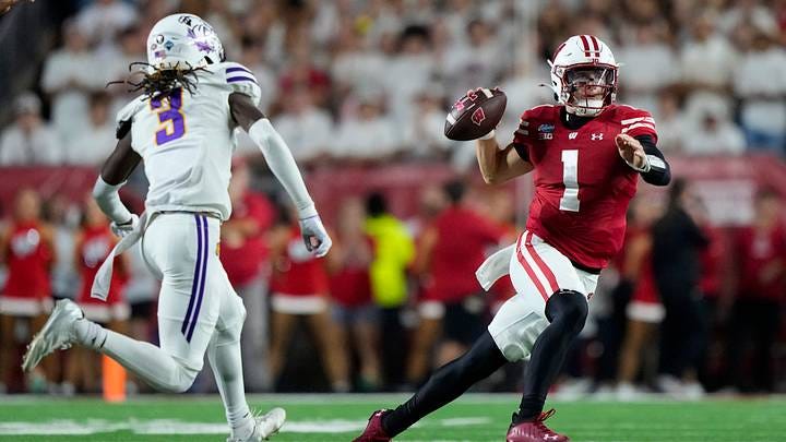 Wisconsin Badgers quarterback Colton Joseph (1) under pressure against Western Illinois Wisconsin Badgers quarterback Colton Joseph (1) under pressure against Western Illinois