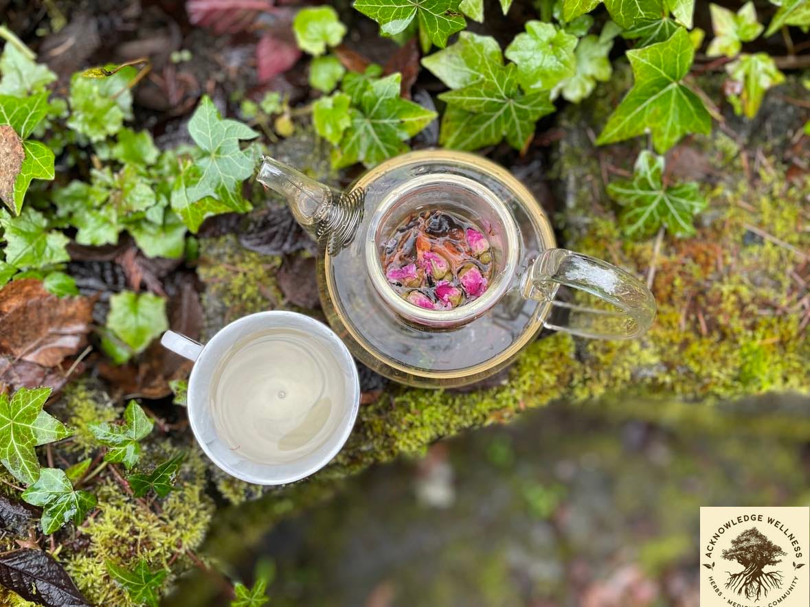 Photo of our Restful Sleep Tea Blend in a Tea Pot on the ledge covered in Ivy.