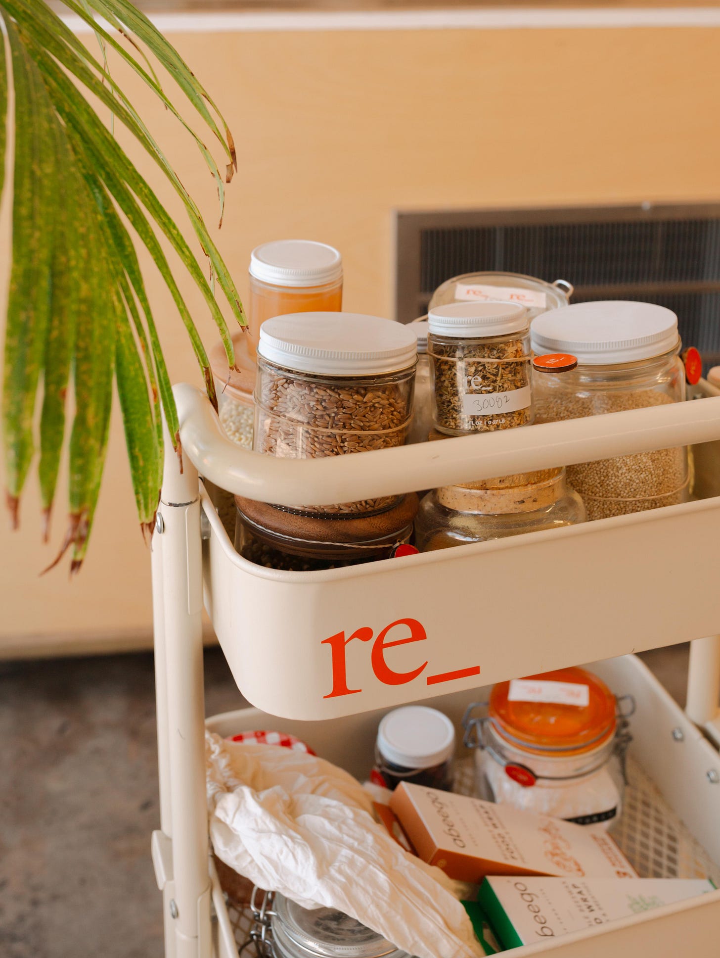 shopping cart full of reusable containers and sustainable zero waste products