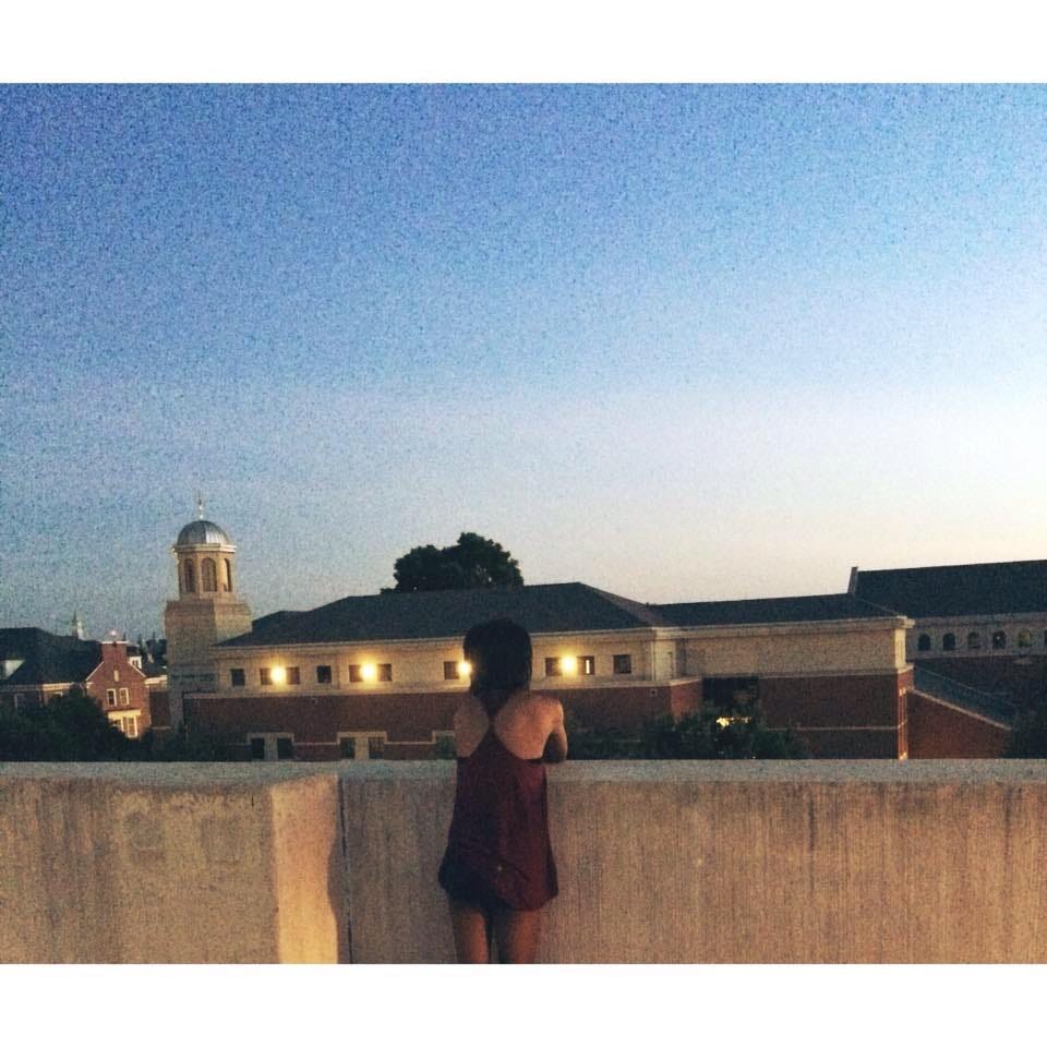 a photo of ari on top of a parking garage