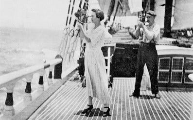 Mrs. Hansen taking the noon site with a sextant on board the barkentine sailing vessel Aurora (J9.8, 059n).