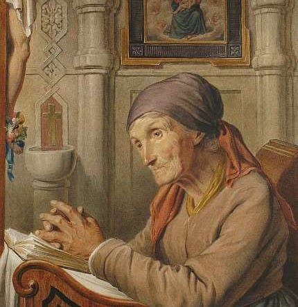 This may contain: an old woman sitting at a desk writing