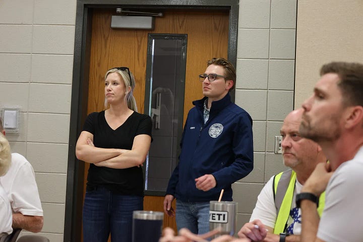 State Senator Sydney Davis stands with Gov. Noem staffer Ben Koisti during a briefing. Gov. Kristi Noem talks with locals after a press conference in Dakota Dunes. (Joe Sneve/The Dakota Scout)