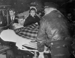 John F. Kennedy and wife Jackie leaving the hospital two months after his 1954 spinal fusion.