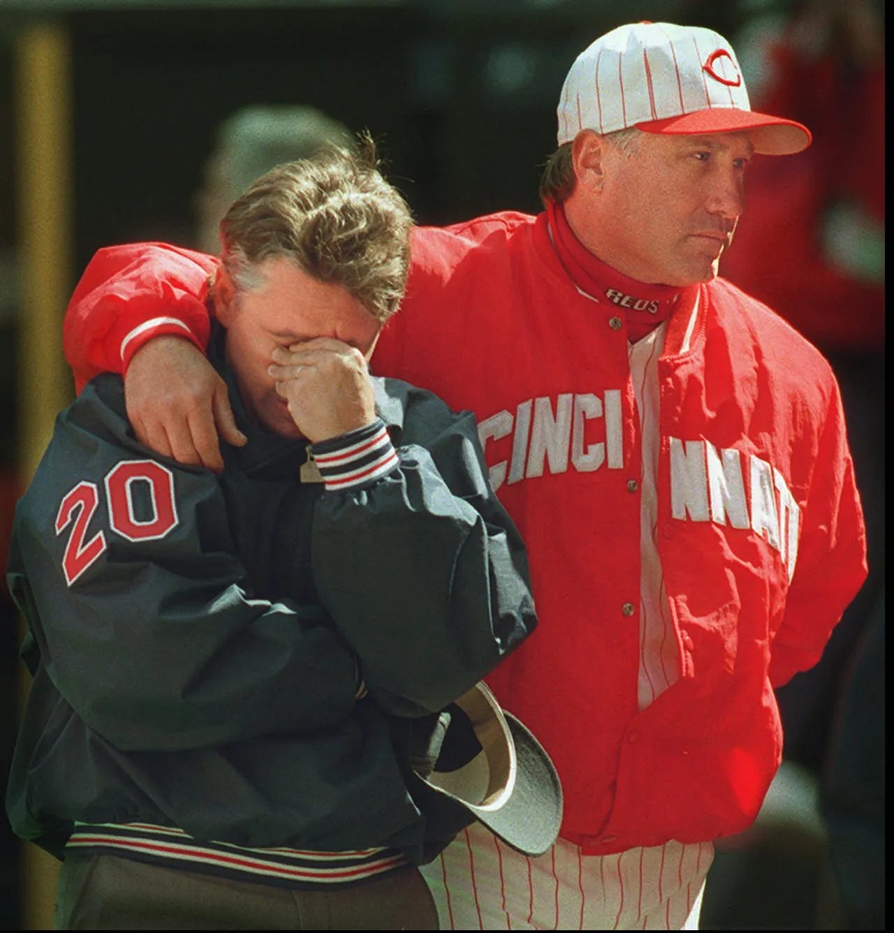 Ray Knight puts an arm around Tom Hallion.