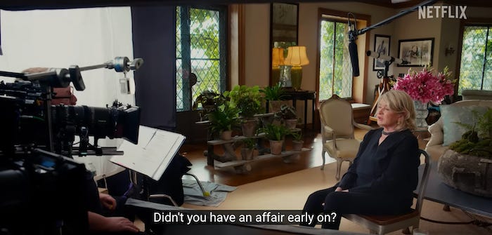 A screenshot from the documentary Martha with Martha Stewart sitting down in front of a camera with the caption “Didn’t you have an affair early on?”