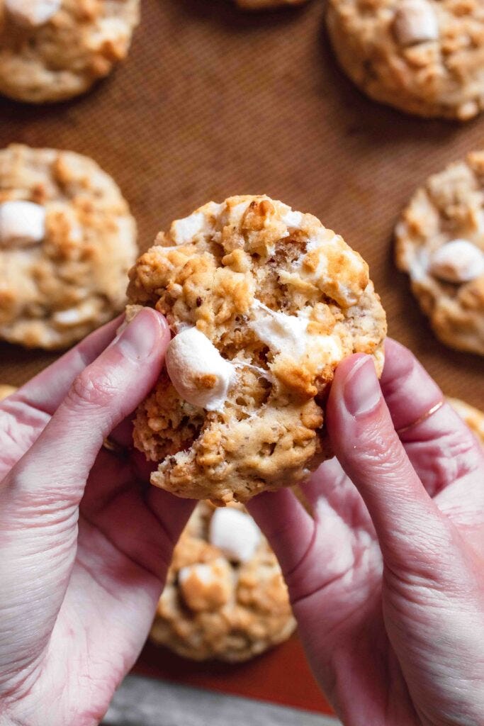Close up of vegan Rice Krispie cookie being broken in half.