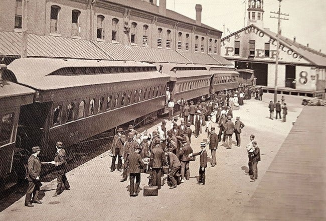 People stand in front of a train. People stand in front of a train.