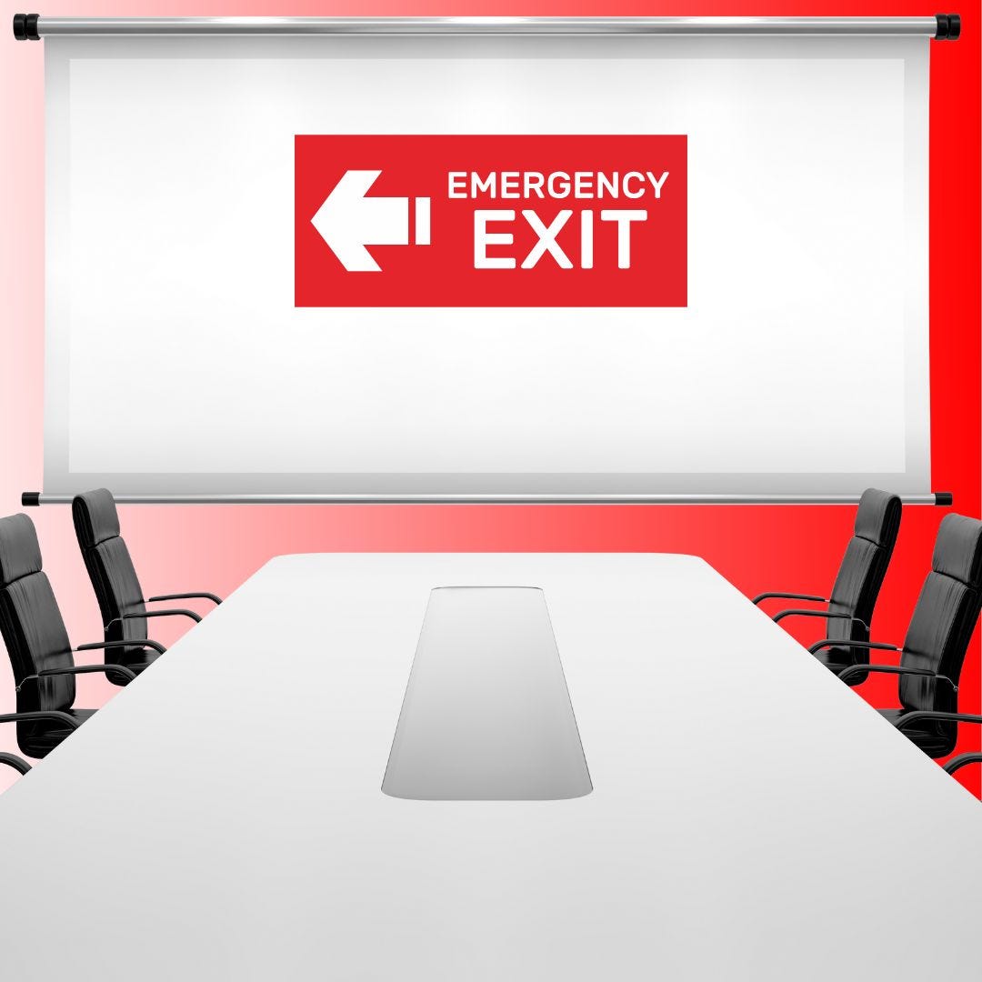 Image of conference room and chairs with message on board which says Emergency Exit with arrow to left