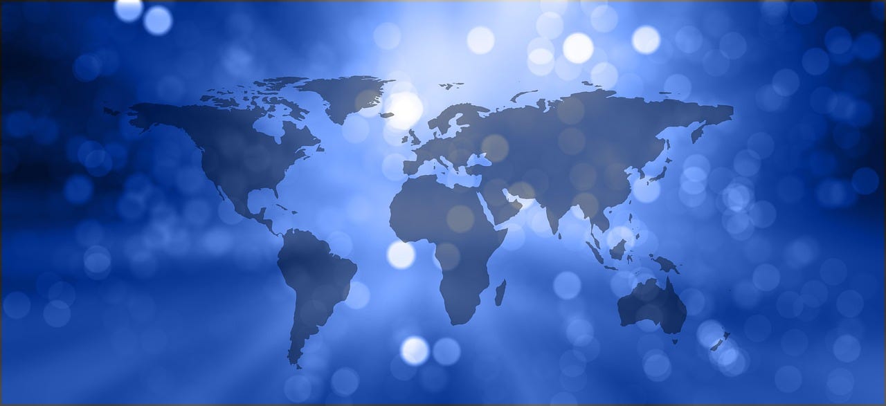 A dark blue on light blue outline of the world map