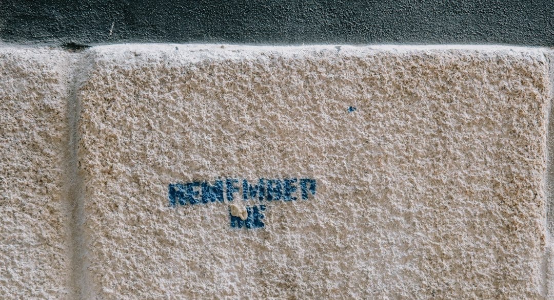 A close up of a wall with writing on it