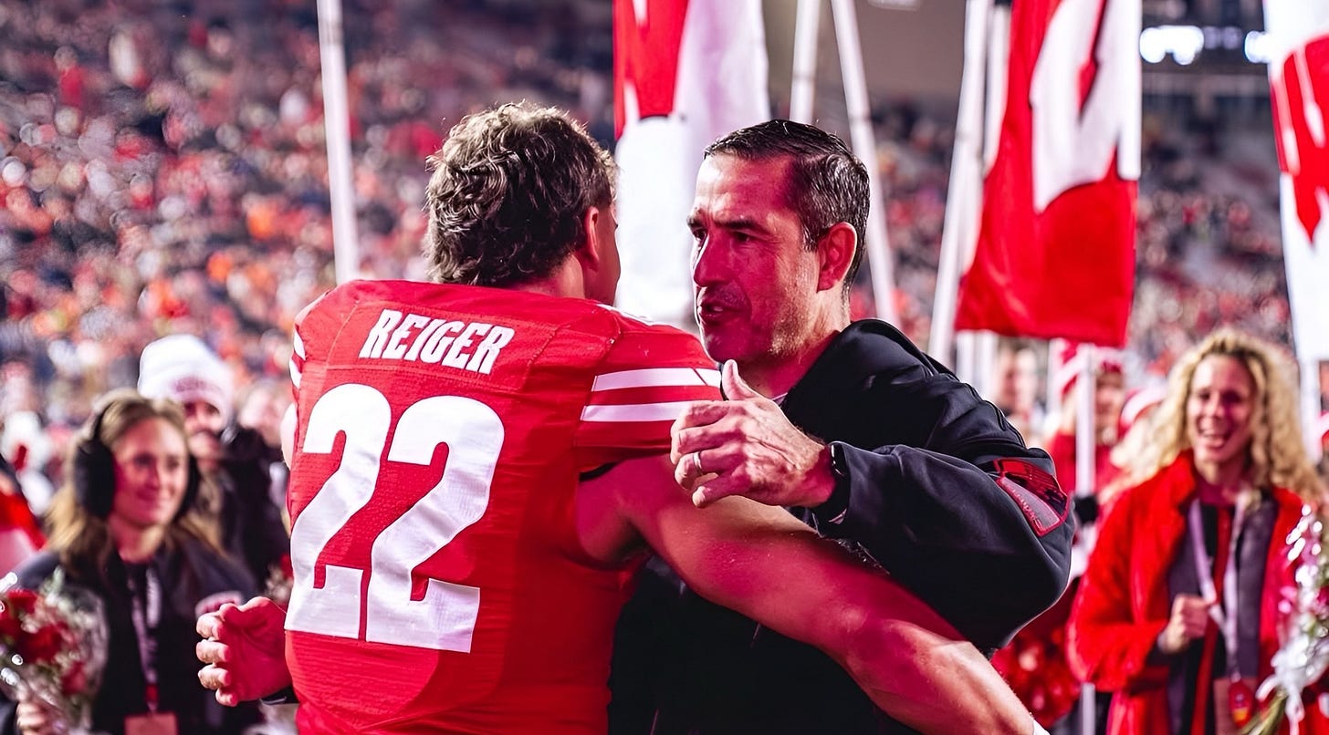 Wisconsin Badgers outside linebacker Mason Reiger embraces head coach Luke Fickell on Senior Day at Camp Randall Stadium. Wisconsin Badgers outside linebacker Mason Reiger embraces head coach Luke Fickell on Senior Day at Camp Randall Stadium.