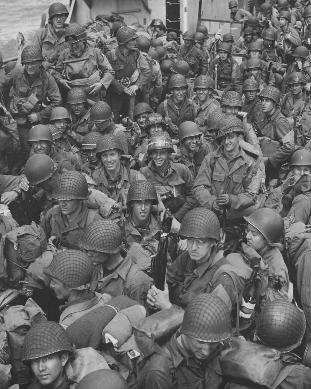 Brave members of the 101st Airborne and 4th Infantry Divisions crowd aboard an LCT, bound for Utah Beach on D-Day, June 6, 1944, poised for history.