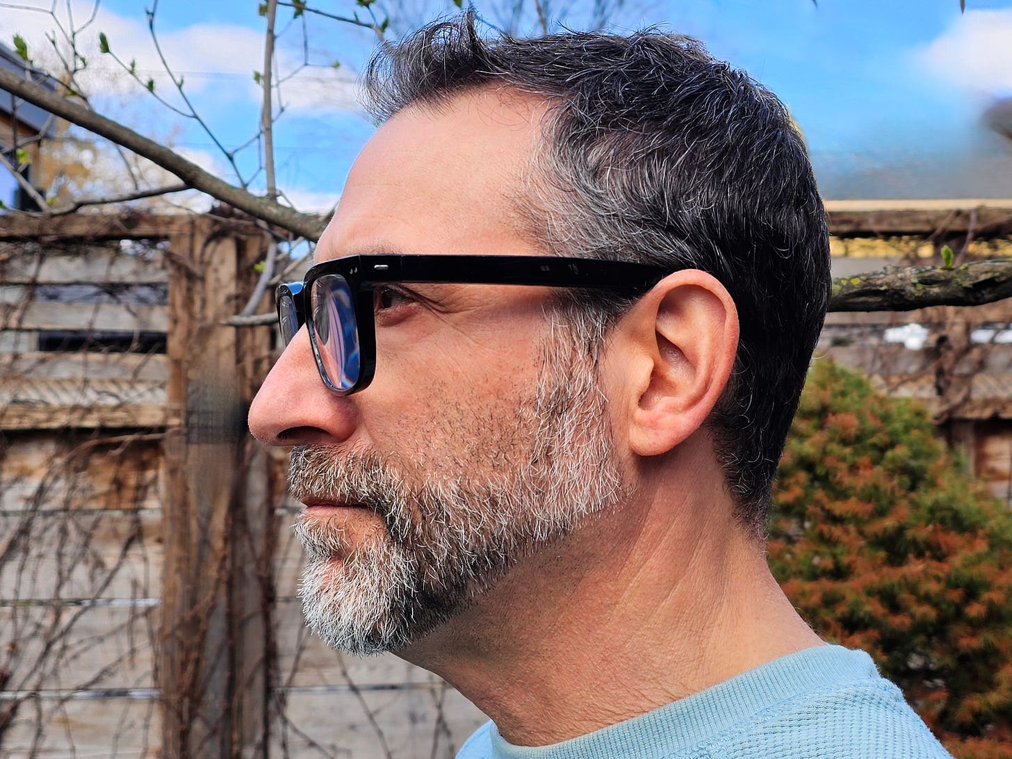 Side view of the author wearing Nuance Audio Hearing Glasses.