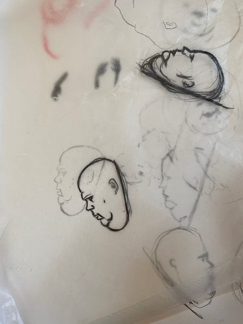 man carved out of pink opal