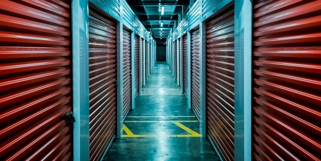 red and gray tunnel with red metal wall