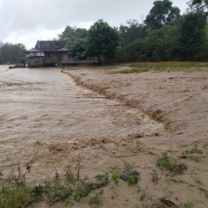 Floods and landslides hit Bali: blocked roads, submerged rice fields, and homes surrounded by rising water..