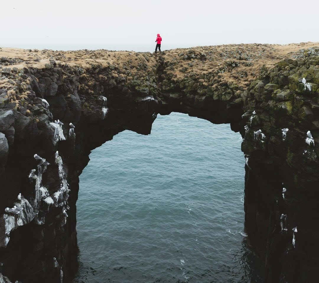 person wearing red pullover hoodie