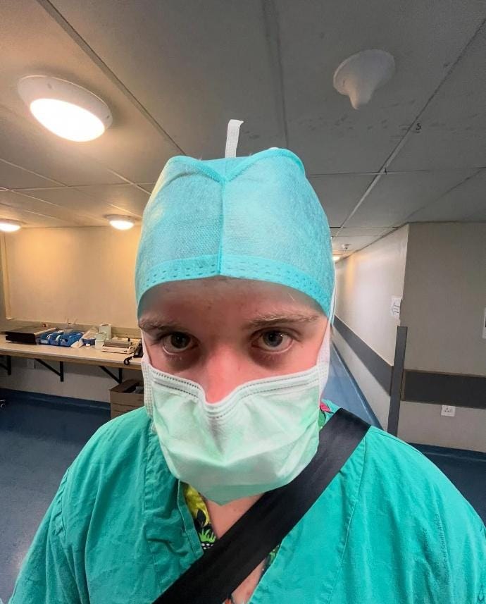 A person wearing a mask and scrubs

AI-generated content may be incorrect.