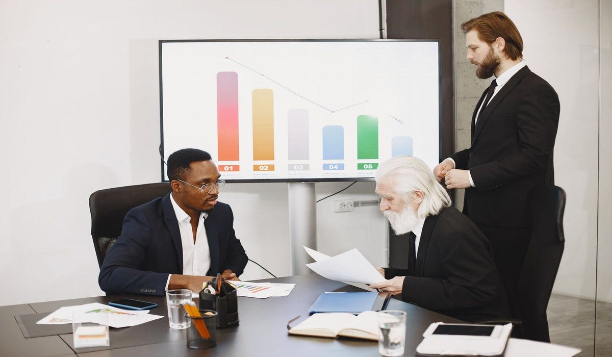 Health system CFO reviewing AI-generated revenue cycle analytics Health system CFO reviewing AI-generated revenue cycle analytics