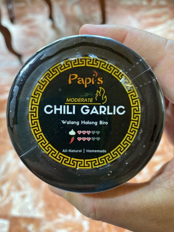 Papi's Chili Garlic A small bottle of moderate spice level Papi's Chili Garlic
