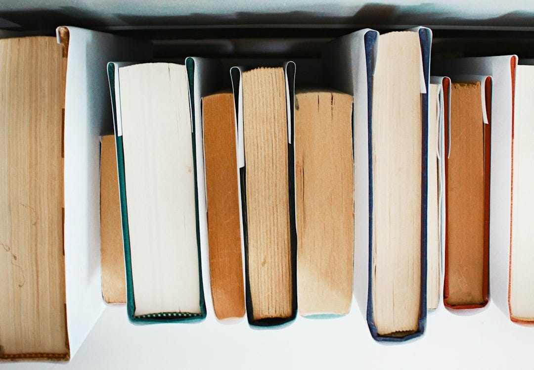 low angle photography of pile of books