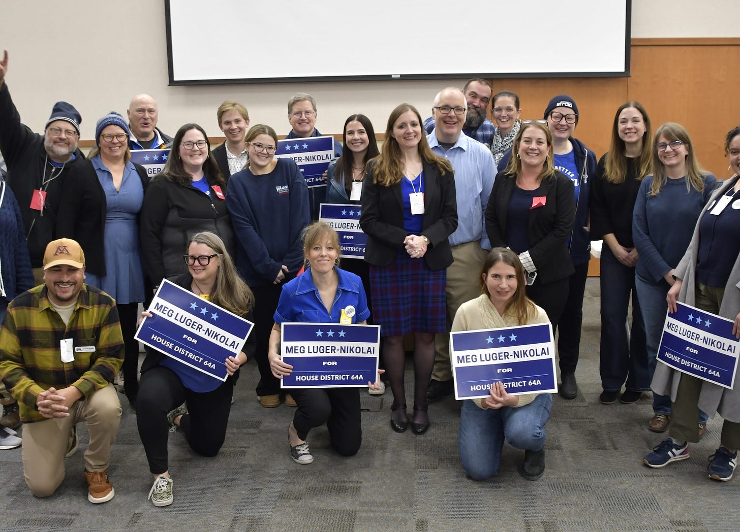 Minnesota Democrat Meg Luger-Nikolai (at center, with hands clasped) and supporters (credit: Meg Luger-Nikolai campaign)