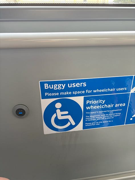 Photo 1: Wheelchair space with back rest Photo 2: USB socket in the wheelchair space Photo 3: Second USB socket
