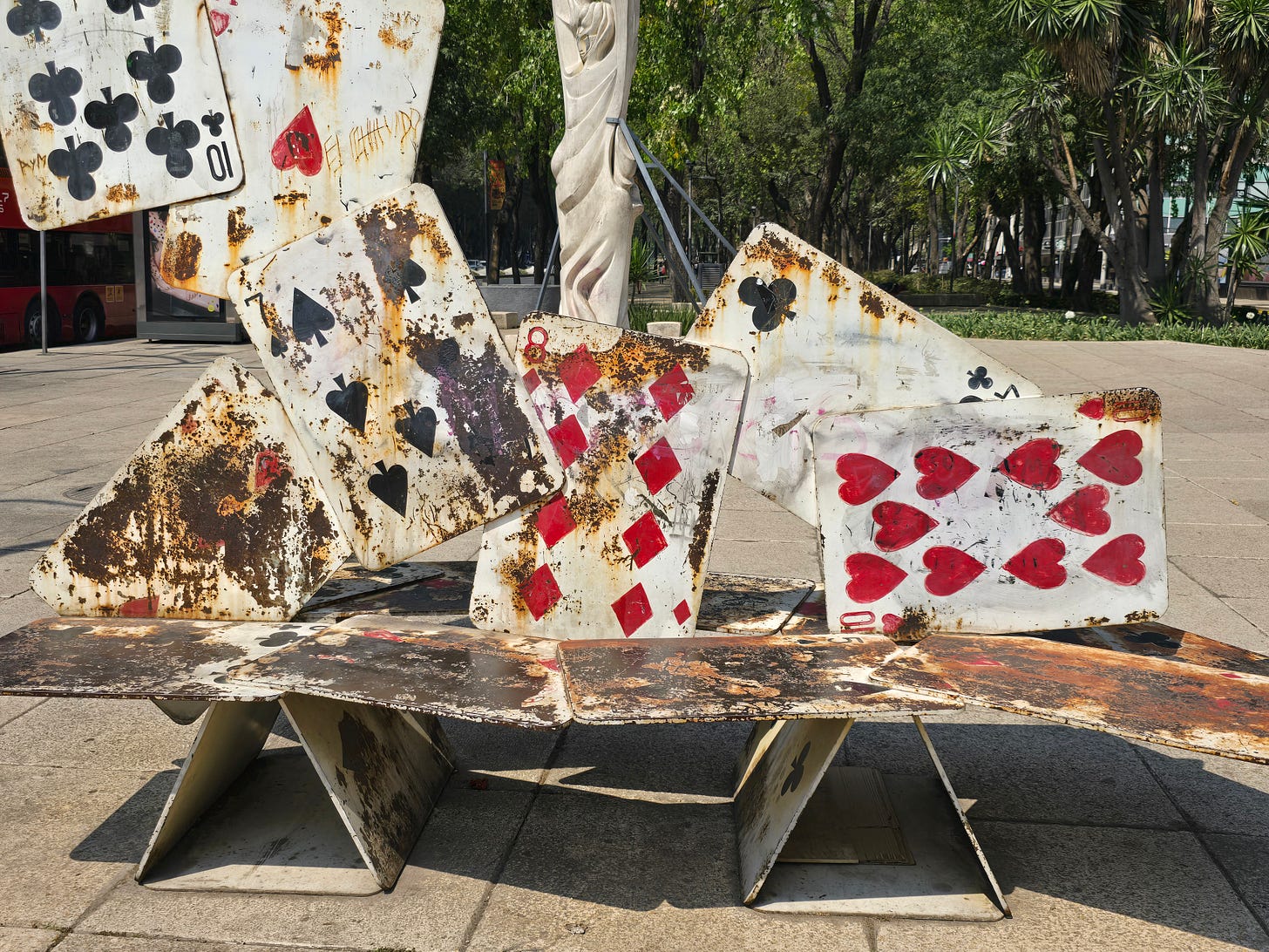 A unique public art bench with a playing card motif on Paseo de la Reforma near Monumento Metropoli in Mexico City.