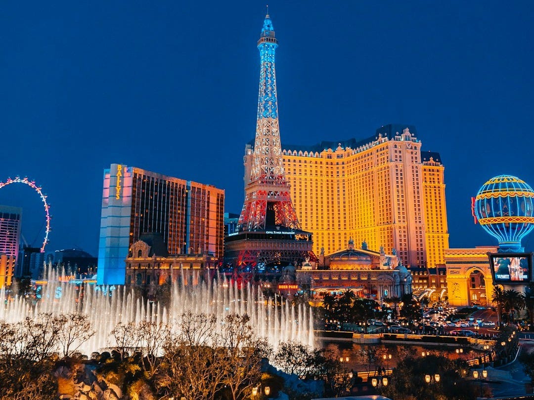 a city with tall buildings and lights a city with tall buildings and lights