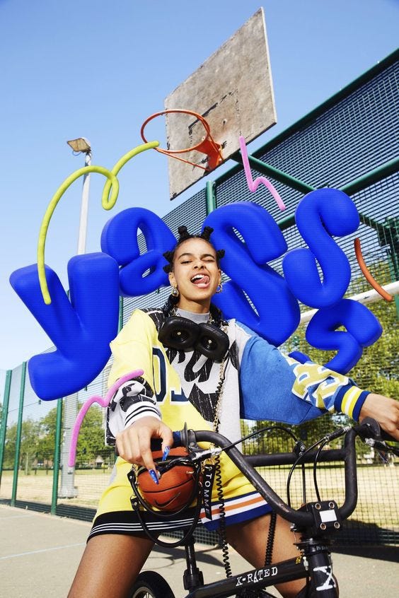 This may contain: a woman sitting on top of a bike next to a basketball hoop