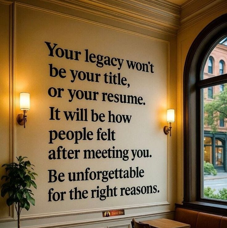 This may contain: a wall that has a quote on it next to a table and chair in front of a window