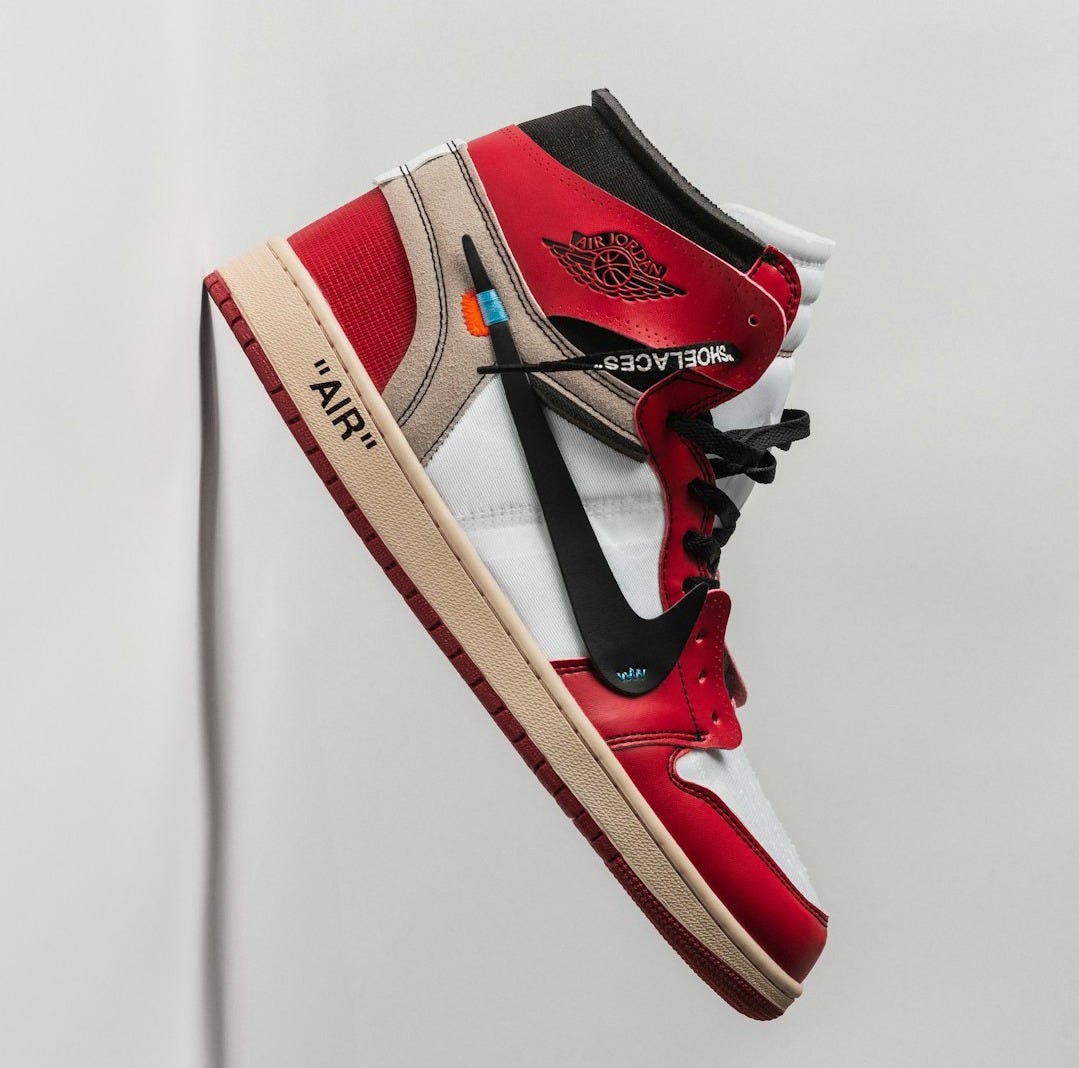 a pair of red, white and black sneakers a pair of red, white and black sneakers