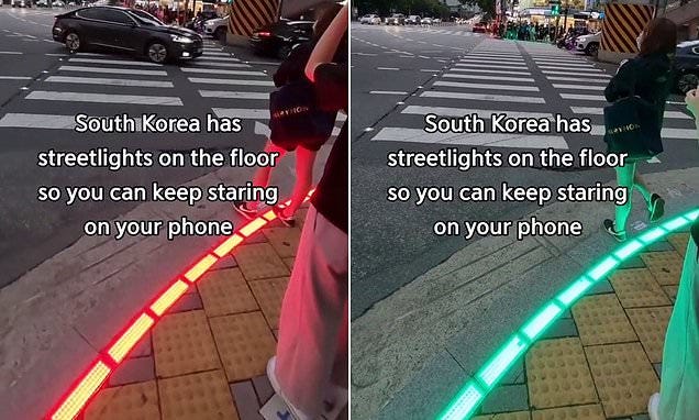 South Korea has street lights on the floor in Seoul to help 'smombies'  cross the road safely | Daily Mail Online