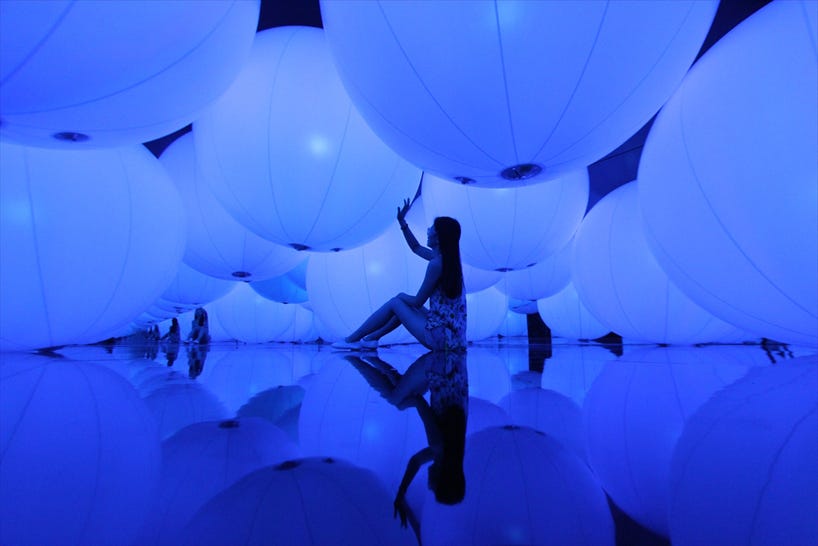 luminous colored spheres by teamlab respond to human touch luminous colored spheres by teamlab respond to human touch