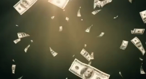 money is falling from the sky on a black background . money is falling from the sky on a black background .