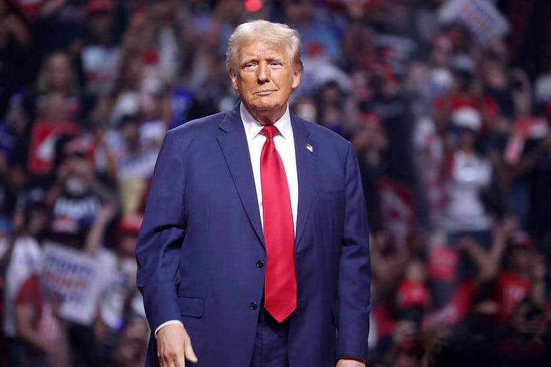 Donald Trump standing in front a rally crowd Donald Trump standing in front a rally crowd