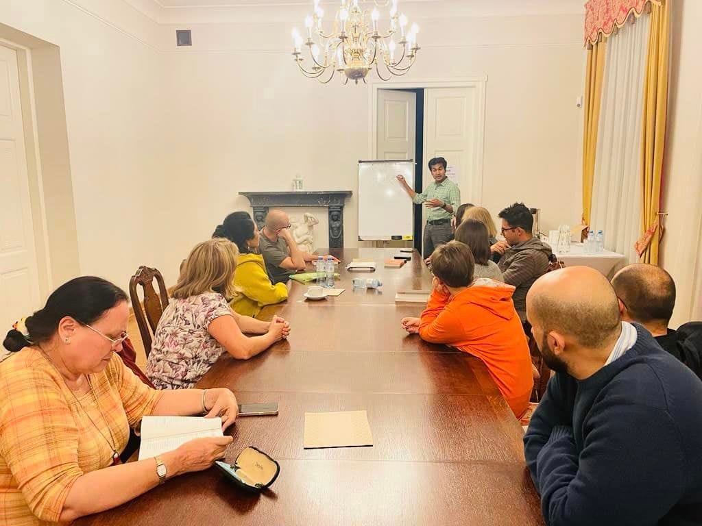 May be an image of 6 people, people sitting, people standing and indoor