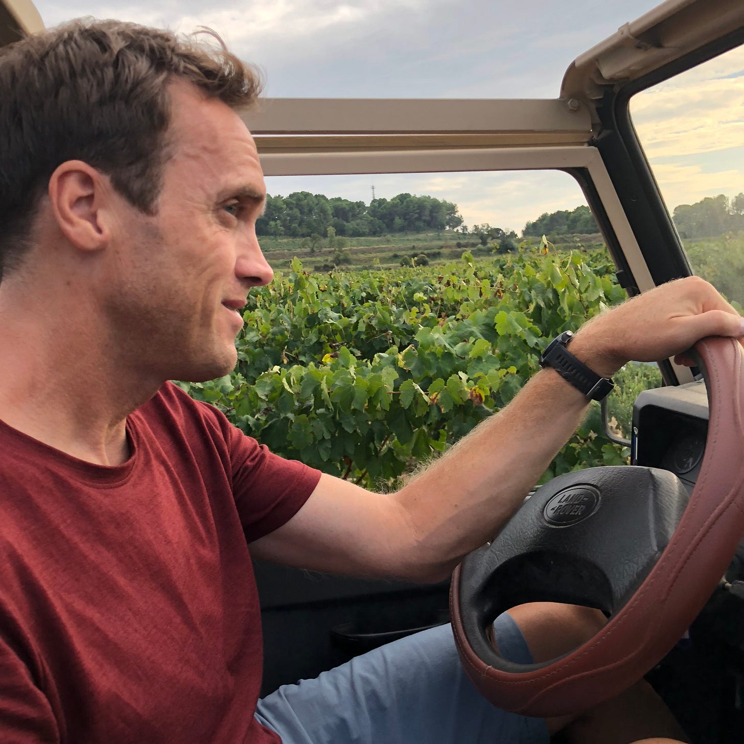 Tom Vanderbilt driving, reflecting his curiosity about how people move and the systems that shape daily life.