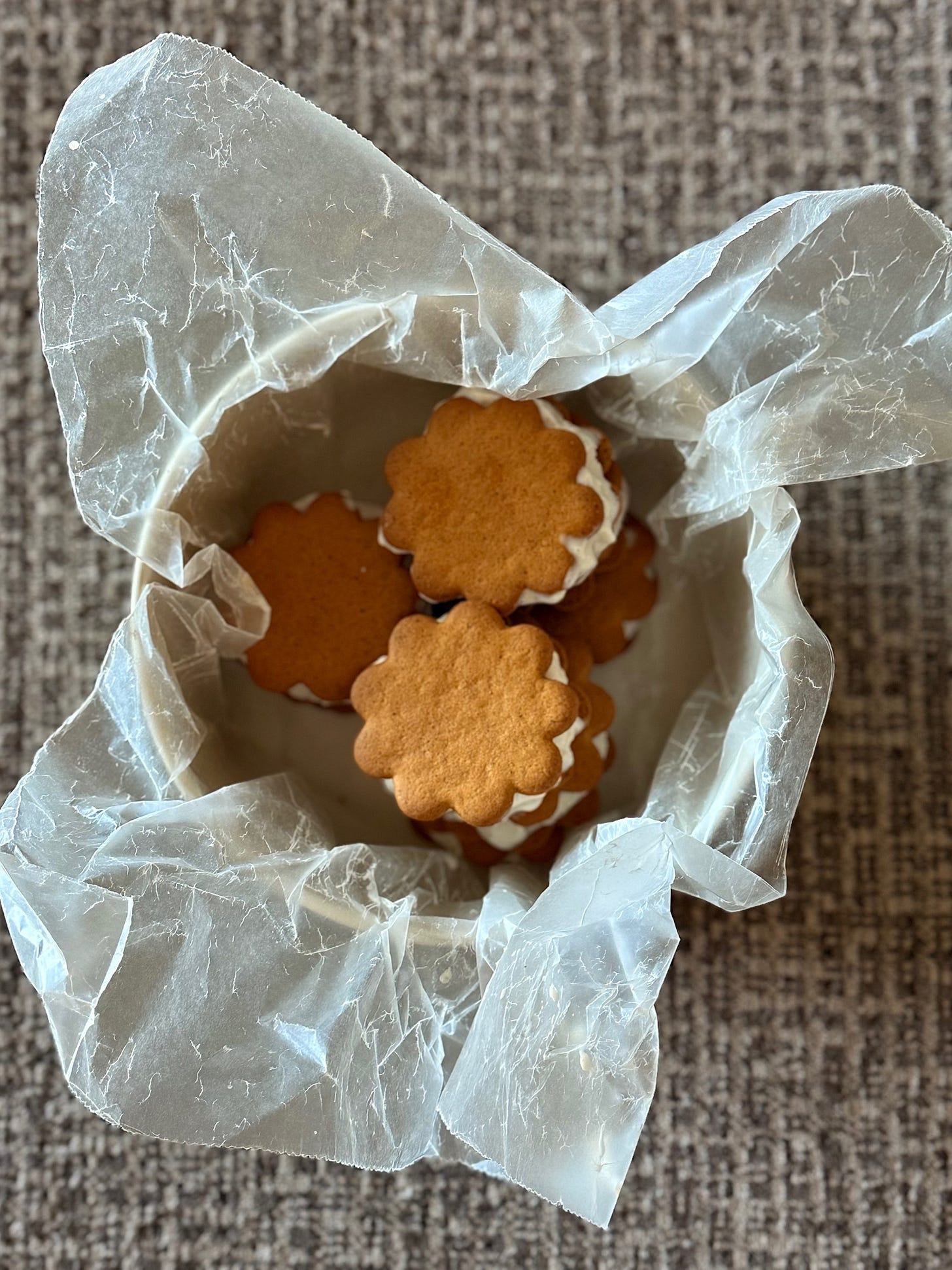 A small container with ice cream sandwiches inside. 