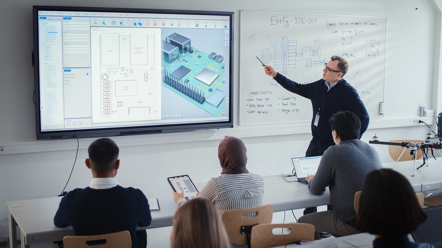 Male Teacher Explains About Computer Motherboard Components to Students During Lesson at University Using Interactive Whiteboard.
