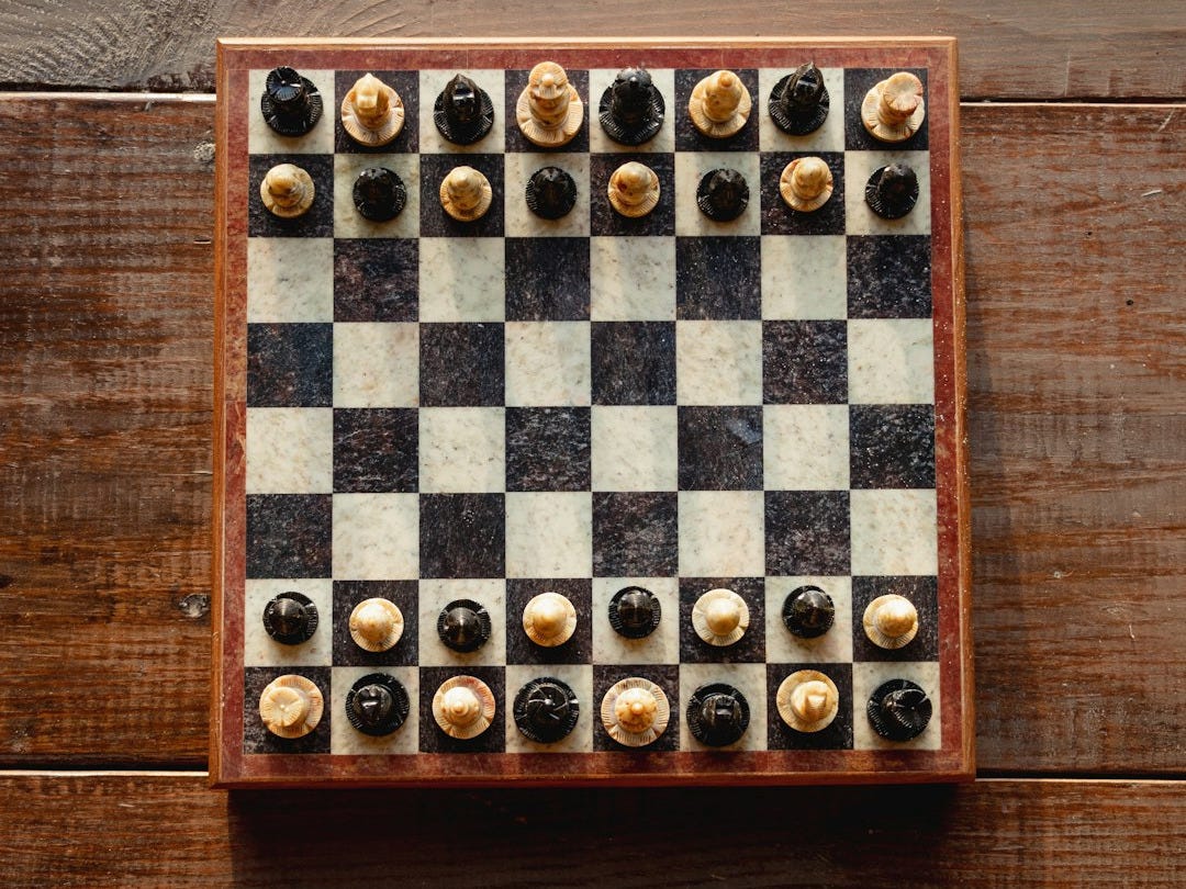 brown and white chess board game brown and white chess board game