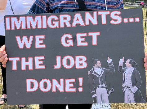 Signs at Bothell No Kings Rally