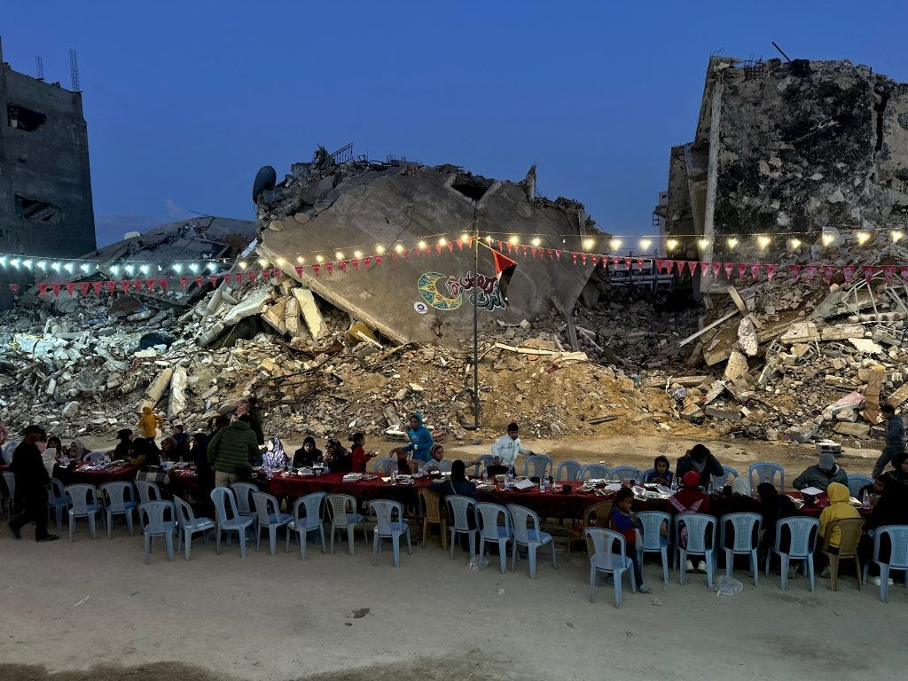 Palestinians break their fast by eating the Iftar meals during the holy month of Ramadan, near the rubble of buildings, amid a ceasefire between Israel and Hamas, in Rafah, in the southern Gaza Strip, March 1, 2025. (Photo by Doaa el-Baz/apaimages) Palestinians break their fast by eating the Iftar meals during the holy month of Ramadan, near the rubble of buildings, amid a ceasefire between Israel and Hamas, in Rafah, in the southern Gaza Strip, March 1, 2025. (Photo by Doaa el-Baz/apaimages)