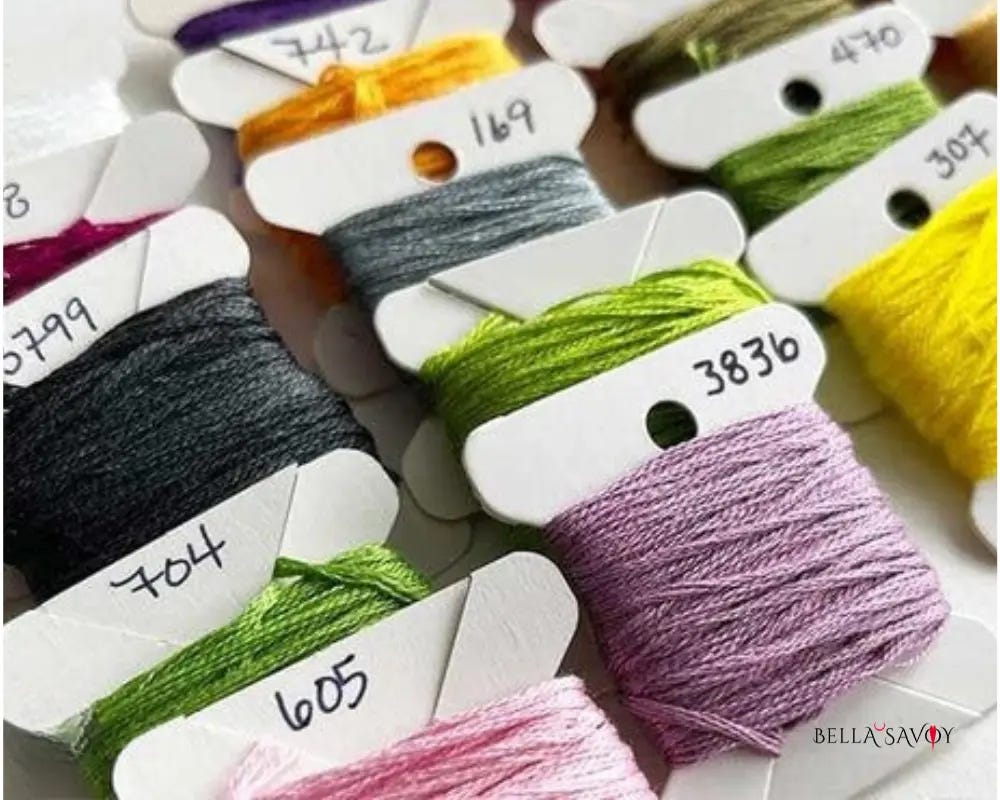 colorful embroidery thread wrapped on labelled cards