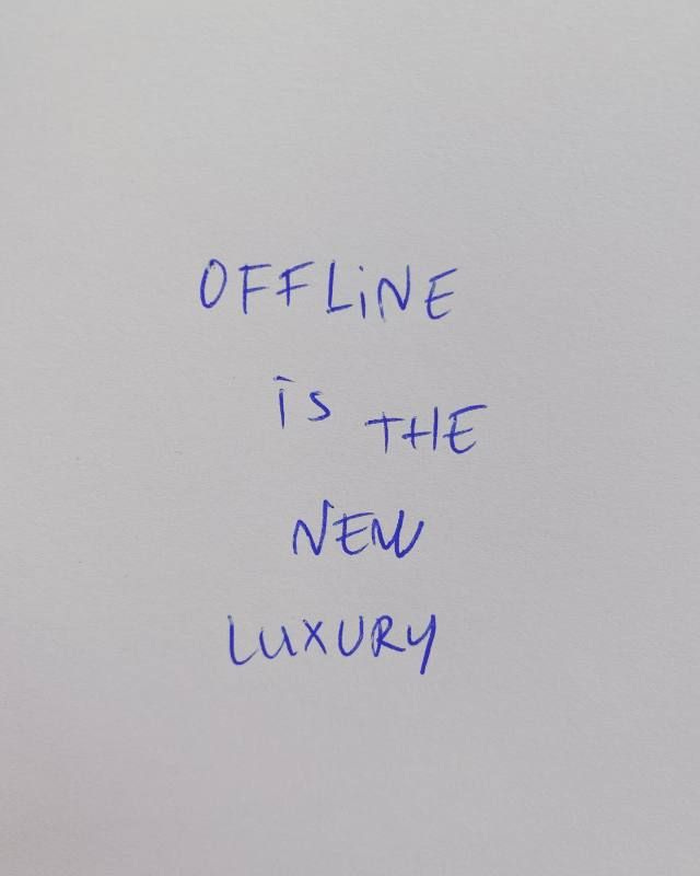 This may contain: a piece of paper with writing on it that says offline is the new luxury