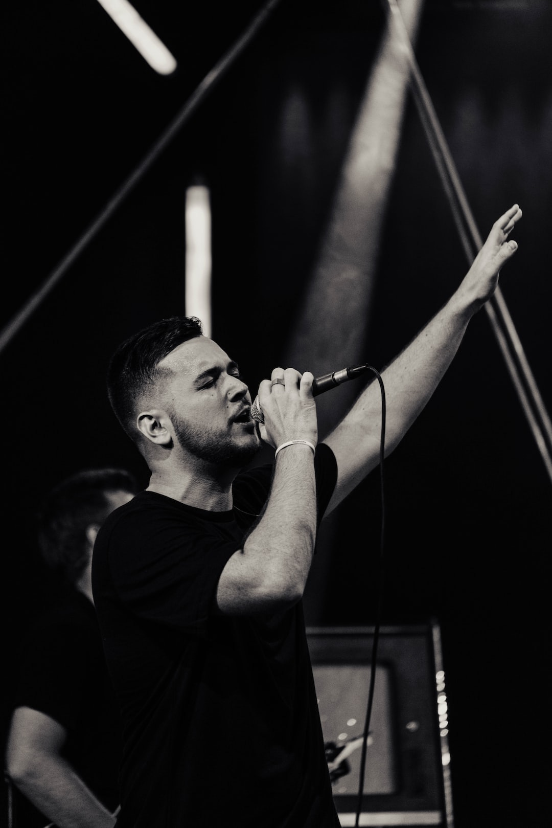 man singing using microphone man singing using microphone