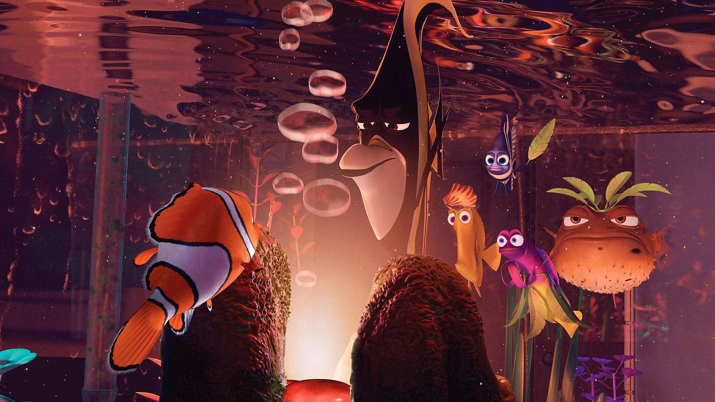 Finding Nemo | Still features the titular character in an aquarium behind a volcano, observed by other fishes. Finding Nemo | Still features the titular character in an aquarium behind a volcano, observed by other fishes.